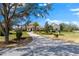 A beautiful single-story house with stone accents, lush lawn, and a long driveway at 12424 Sw 140Th Loop, Dunnellon, FL 34432