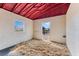 Inside a bright horse stall with wood shavings, showcasing the stable's simple yet sturdy construction at 12424 Sw 140Th Loop, Dunnellon, FL 34432