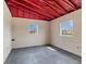 This well-lit horse stall has a simple design with bright walls, rubber flooring, and ample space for equine comfort at 12424 Sw 140Th Loop, Dunnellon, FL 34432