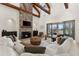 Open-concept living room with fireplace and access to outdoor pool area at 12424 Sw 140Th Loop, Dunnellon, FL 34432