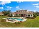 Wonderful pool area complete with a hot tub, lounge chairs, and manicured landscaping at 12424 Sw 140Th Loop, Dunnellon, FL 34432