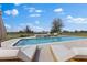 Inviting swimming pool with comfortable lounge chairs and a serene outdoor setting at 12424 Sw 140Th Loop, Dunnellon, FL 34432