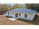 Rear exterior with patio area and sliding glass door at 13495 Sw 114Th Ln, Dunnellon, FL 34432