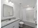 Well-lit bathroom featuring a granite-topped vanity and a shower-tub combination at 13495 Sw 114Th Ln, Dunnellon, FL 34432