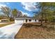 Inviting single-story home featuring a clean driveway and freshly prepped landscaping at 13495 Sw 114Th Ln, Dunnellon, FL 34432