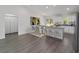 Open kitchen with island and barstool seating at 13495 Sw 114Th Ln, Dunnellon, FL 34432