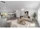 Open-concept living room and kitchen with an abundance of natural light at 13495 Sw 114Th Ln, Dunnellon, FL 34432