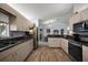Spacious kitchen with stainless steel appliances, a breakfast bar, and plenty of cabinets at 13751 Se 88Th Ct, Summerfield, FL 34491