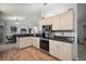 Well-lit kitchen with stainless steel appliances, plenty of cabinet space, and a modern design at 13751 Se 88Th Ct, Summerfield, FL 34491