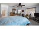 Comfortable main bedroom with a bed, sitting area, and access to an ensuite bathroom at 13751 Se 88Th Ct, Summerfield, FL 34491