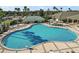 Resort-style pool with diving board, plenty of seating, and shade at 13751 Se 88Th Ct, Summerfield, FL 34491