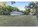 Sprawling backyard with mature trees, providing ample space for outdoor activities and privacy at 13920 Ne 38Th Ave, Anthony, FL 32617