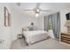 Comfortable bedroom with soft gray tones, ceiling fan, and cozy decor at 13920 Ne 38Th Ave, Anthony, FL 32617