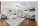 Bright bedroom with wood floors, tray ceiling, and multiple windows at 13920 Ne 38Th Ave, Anthony, FL 32617