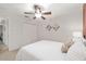 Bright bedroom featuring white linens, double door closet, and soft, natural light at 13920 Ne 38Th Ave, Anthony, FL 32617