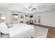 Bright bedroom with wood floors, tray ceiling, and multiple windows at 13920 Ne 38Th Ave, Anthony, FL 32617