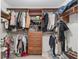 Well-organized walk-in closet with custom shelving, drawers, and ample hanging space for clothing and accessories at 13920 Ne 38Th Ave, Anthony, FL 32617