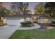 Charming single-story home featuring a two-car garage, manicured lawn, and inviting curb appeal at 13920 Ne 38Th Ave, Anthony, FL 32617
