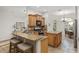 Kitchen featuring wooden cabinets, granite countertops, and stainless-steel appliances at 13920 Ne 38Th Ave, Anthony, FL 32617