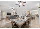 Open-concept living space with dining area, living room, and kitchen featuring a breakfast bar at 13920 Ne 38Th Ave, Anthony, FL 32617