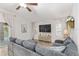 Inviting living room with comfortable seating, large windows, and tile flooring throughout at 13920 Ne 38Th Ave, Anthony, FL 32617