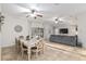 Open-concept living room featuring dining area, comfortable seating, and large sliding doors to outdoor living at 13920 Ne 38Th Ave, Anthony, FL 32617