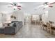 Spacious living room with tile floors, neutral walls and open layout to dining and kitchen areas at 13920 Ne 38Th Ave, Anthony, FL 32617