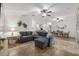 Open-concept living room with tile floors, ceiling fans, and seamless flow to the dining area at 13920 Ne 38Th Ave, Anthony, FL 32617