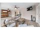 Comfortable covered patio with outdoor seating, a ceiling fan, and a TV, creating a perfect space for relaxation at 13920 Ne 38Th Ave, Anthony, FL 32617