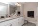 Bathroom featuring double sinks with granite countertops and contemporary fixtures with grey flooring at 14 Hemlock Loop Court, Ocala, FL 34472