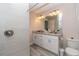 Bathroom with a tiled shower, granite countertop vanity, and modern fixtures at 14 Hemlock Loop Court, Ocala, FL 34472