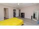 Large bedroom featuring light gray floors, closet, and an ensuite bathroom at 14 Hemlock Loop Court, Ocala, FL 34472