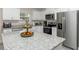 Modern kitchen featuring granite countertops, stainless steel appliances, ample cabinet space, and natural light at 14 Hemlock Loop Court, Ocala, FL 34472
