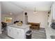 Open kitchen showcasing granite countertops, modern appliances, white cabinetry, and an eat-in dining area at 14 Hemlock Loop Court, Ocala, FL 34472