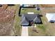 Aerial view of home with a pool, fenced-in yard, and a driveway leading to the garage at 14 Juniper Drive Crse, Ocala, FL 34480