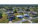 Community aerial shot featuring various single-Gathering homes, swimming pools, and lush green landscaping at 14 Juniper Drive Crse, Ocala, FL 34480