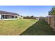 Large fenced-in backyard offering plenty of space for outdoor activities and privacy at 14 Juniper Drive Crse, Ocala, FL 34480