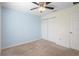 Bedroom features a ceiling fan and closet for ample storage at 14 Juniper Drive Crse, Ocala, FL 34480