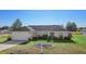 Charming single-story home featuring a well-maintained lawn and an attached two-car garage at 14 Juniper Drive Crse, Ocala, FL 34480