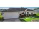 Charming single-story home featuring a two-car garage and well-maintained landscaping at 14 Juniper Drive Crse, Ocala, FL 34480