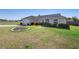 Pleasant single-story home featuring a two-car garage, modest landscaping, and a grassy front yard at 14 Juniper Drive Crse, Ocala, FL 34480