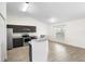 Modern kitchen with stainless steel appliances, a breakfast bar, and an adjacent dining area with backyard views at 14 Juniper Drive Crse, Ocala, FL 34480