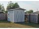 Outdoor storage shed with double doors offering a convenient solution for all your gardening equipment and tools at 14 Juniper Drive Crse, Ocala, FL 34480