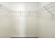 Bright, empty walk-in closet with built-in shelving at 14 Juniper Drive Crse, Ocala, FL 34480