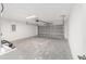 A spacious garage with an automatic door, concrete flooring, and room for storage at 20764 Sw Starling Dr, Dunnellon, FL 34431
