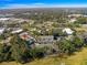 Property aerial view showing location, and surrounding community features and lush landscape at 231 Ne 28Th Ave # 103, Ocala, FL 34470