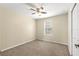 Neutral bedroom featuring a large window to brighten up the space and a ceiling fan at 231 Ne 28Th Ave # 103, Ocala, FL 34470