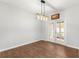 Elegant dining area featuring wood floors, French doors, and a modern chandelier at 231 Ne 28Th Ave # 103, Ocala, FL 34470