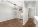 Bright dining room featuring wood floors, French doors, and stylish light fixture at 231 Ne 28Th Ave # 103, Ocala, FL 34470