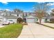 Charming townhome featuring well-manicured landscaping and attached two car garage at 231 Ne 28Th Ave # 103, Ocala, FL 34470